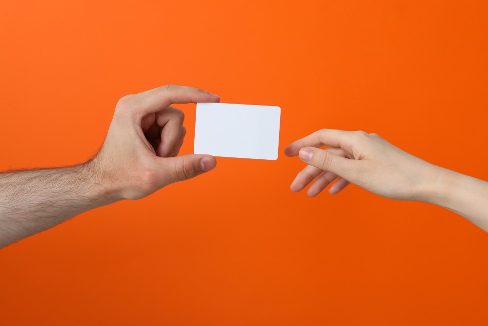 female-and-male-hand-with-blank-paper-2024-06-12-23-22-04-utc